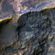 An ancient clay and carbonate-bearing rock exposed in a crater in Hesperia Planum, Mars. (Image: NASA/JPL/University of Arizona)